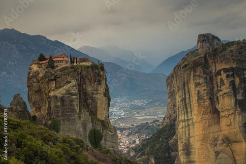 Scenic view of Meteora against mountains photo