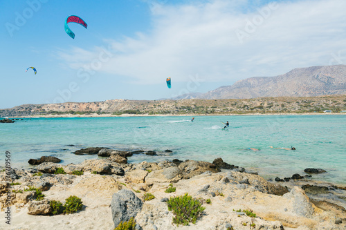 Scenic view of Kite boarders over Elafonissi Beach photo