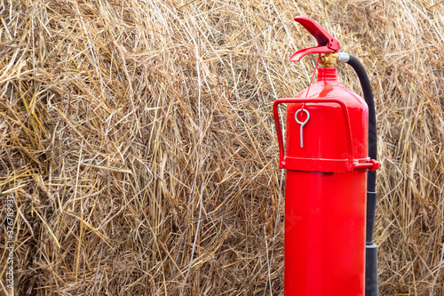 Red fire extinguisher on th...
