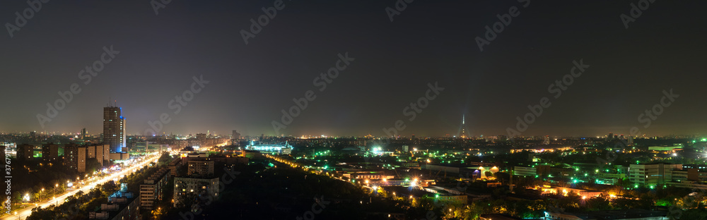 Fototapeta premium Horizontal panorama of the night Golyanovo district of Moscow view from a high rise building towards the city center