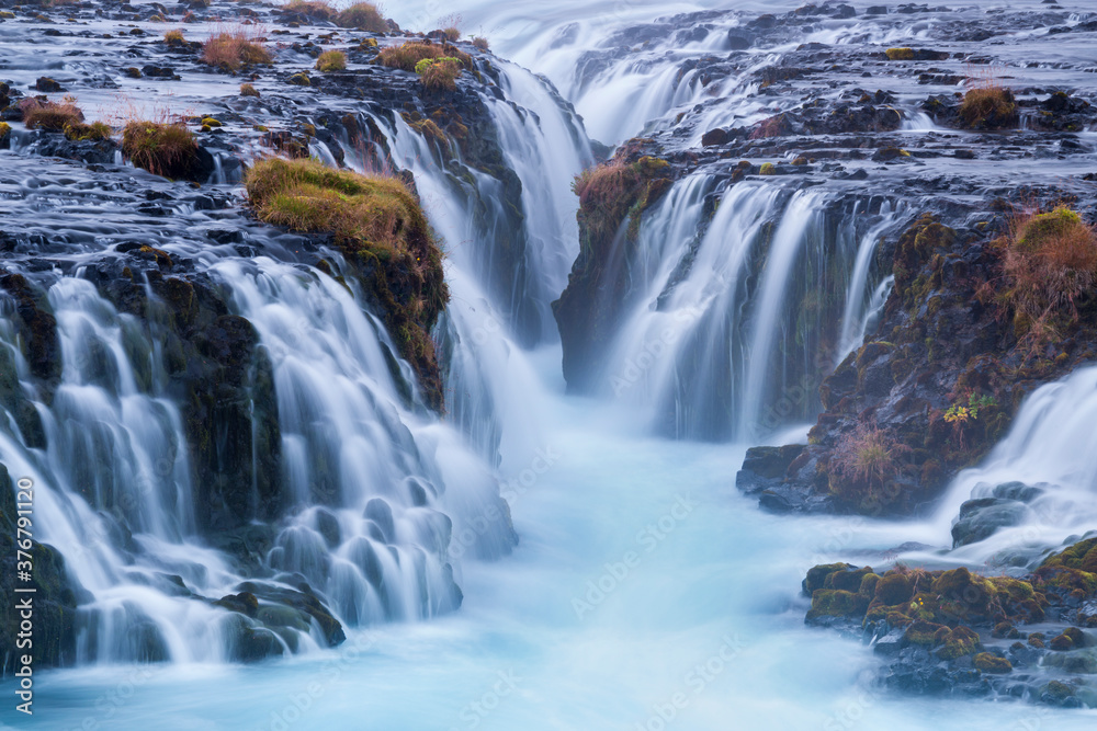 Scenic view of Bruarfoss waterfall Scenic view of Bruarfoss waterfall