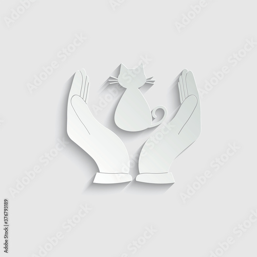 paper cat care icon. the hand  is holding a cat vector icon veterinary