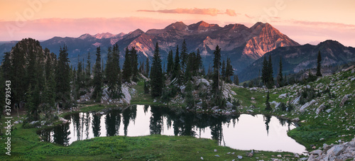View of Silver Glance Lake with Wasatch Range in background during sunset photo