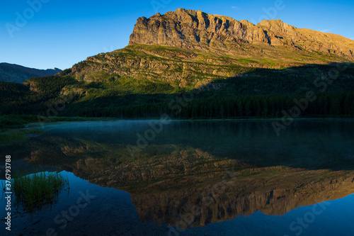 View of mountain reflecting in Fishercap Lake photo