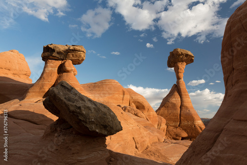 View of toadstool rocks against cloudy sky