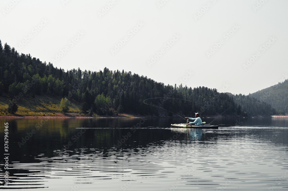 Man Kayak fishing in colorado