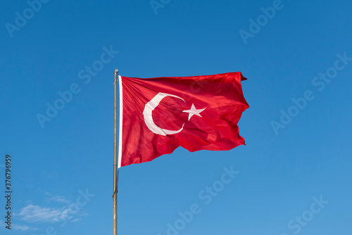 Turkish national flag waving in the blue sky