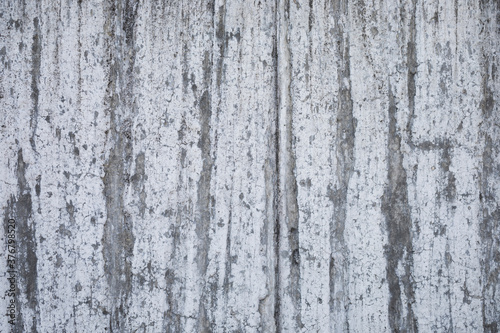 grey concrete stone wall looks like paper, urban and aged cement wall for a background, space for text, horizontal and no person