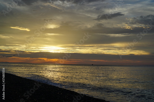 Beautiful orange sunset above the sea  below the cloudy sky  Japan