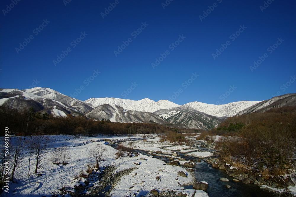 Amazing winter location in the Japan Alps, surrounded by snow-capped mountains.