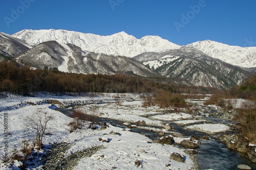 Amazing winter location in the Japan Alps, surrounded by snow-capped mountains.