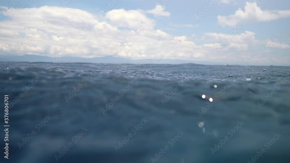 Rain drops into the endless ocean, close up. Rain drops into the endless ocean, close up.