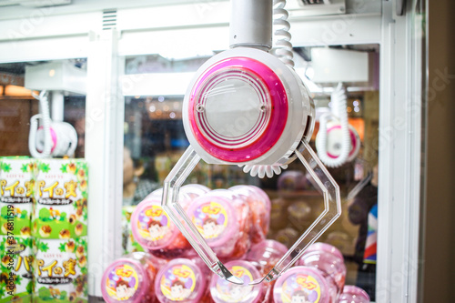 Close up of a claw machine in a Japanese arcade