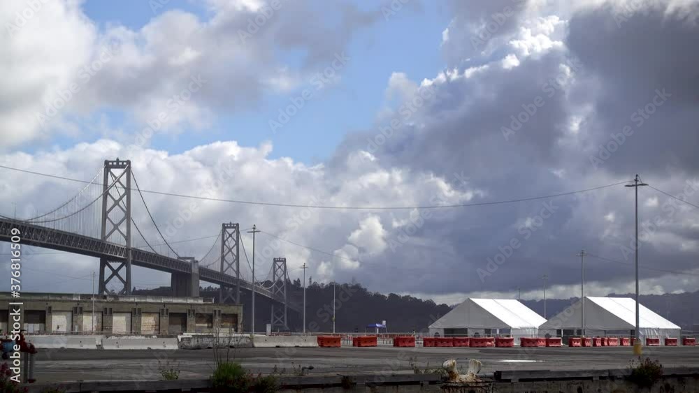 City Test SF COVID 19 Testing Site as Car Drives In & Bay Bridge, Treasure Island Backdrop City Test SF COVID 19 Testing Site as Car Drives In & Bay Bridge, Treasure Island Backdrop