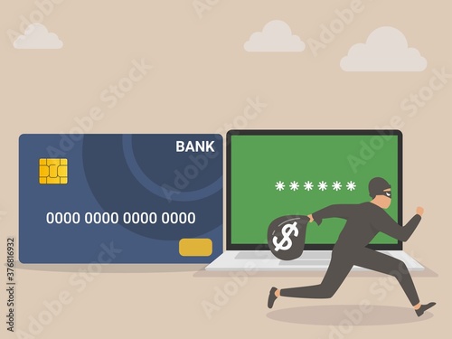 Credit card online hacking, online hacking or financial robbery concept, young mysterious thief with dark black robbery running with big bag with dollar sign money sign from credit card online payment