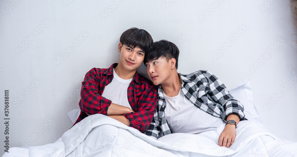 Fototapeta premium Two beloved young men slept in bed together.