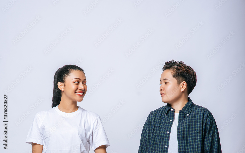 Couple women standing and looking at each other. Couple women standing and looking at each other.