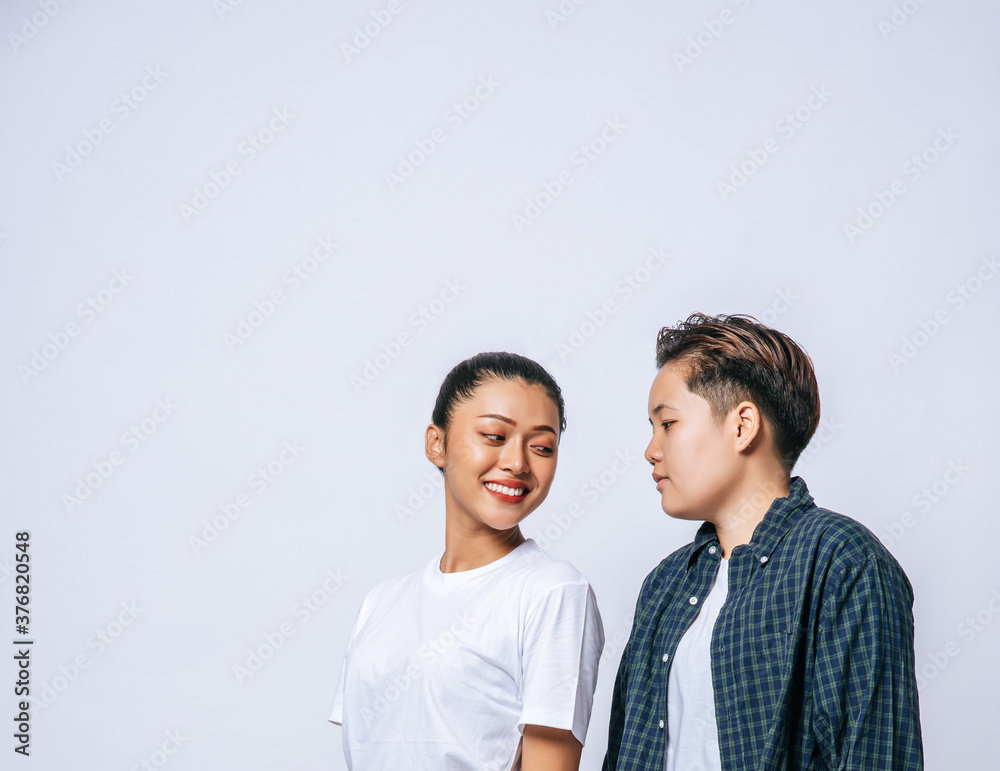 Couple women standing and looking at each other. Couple women standing and looking at each other.