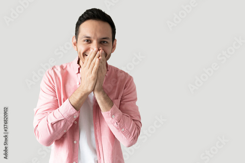 Excited young man looking eager and happy