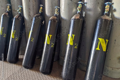 High pressure nitrogen gas cylinders. Seamless steel industrial gas cylinders. Industrial steel bottles in line.