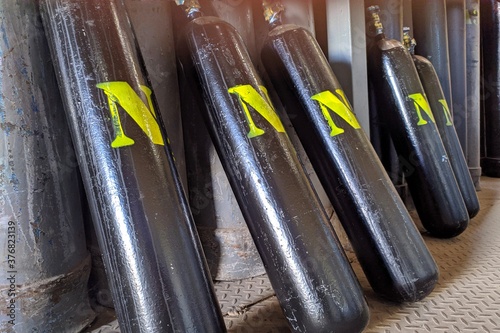 Nitrogen gas cylinders. Seamless steel industrial gas cylinders. Industrial steel bottles in line.