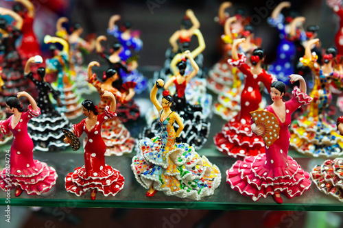 Famous Spanish handcrafted souvenirs flamenco dancers figurines displayed in shop for sale
