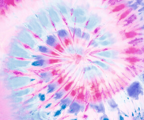 Spiral tie dye pattern wallpaper background in skyblue, blue and magenta.