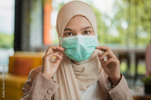 Muslim woman wearing face mask. safety and coronavirus pandemic