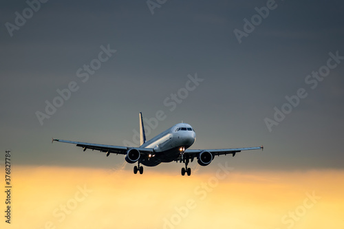 Passenger plane on sunset
