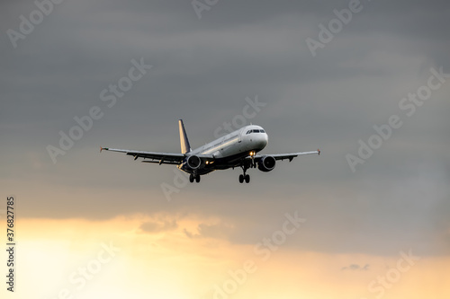 Passenger plane on sunset