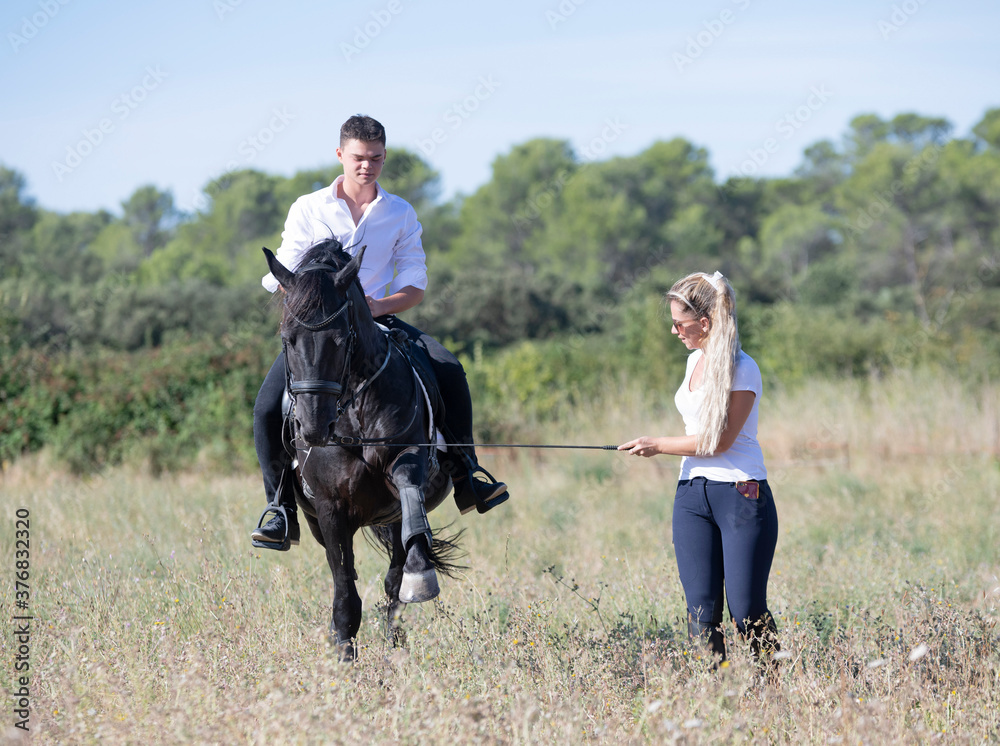 riding teenager, teacher and horse