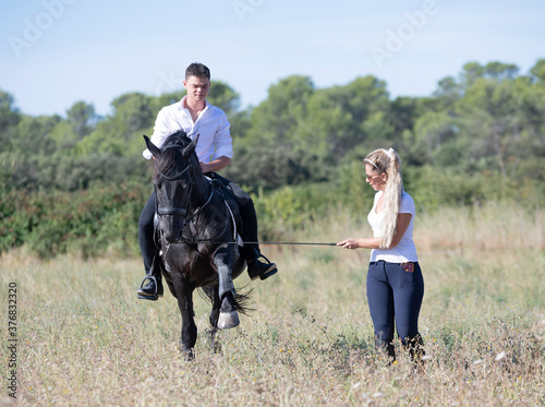 riding teenager, teacher and horse © cynoclub