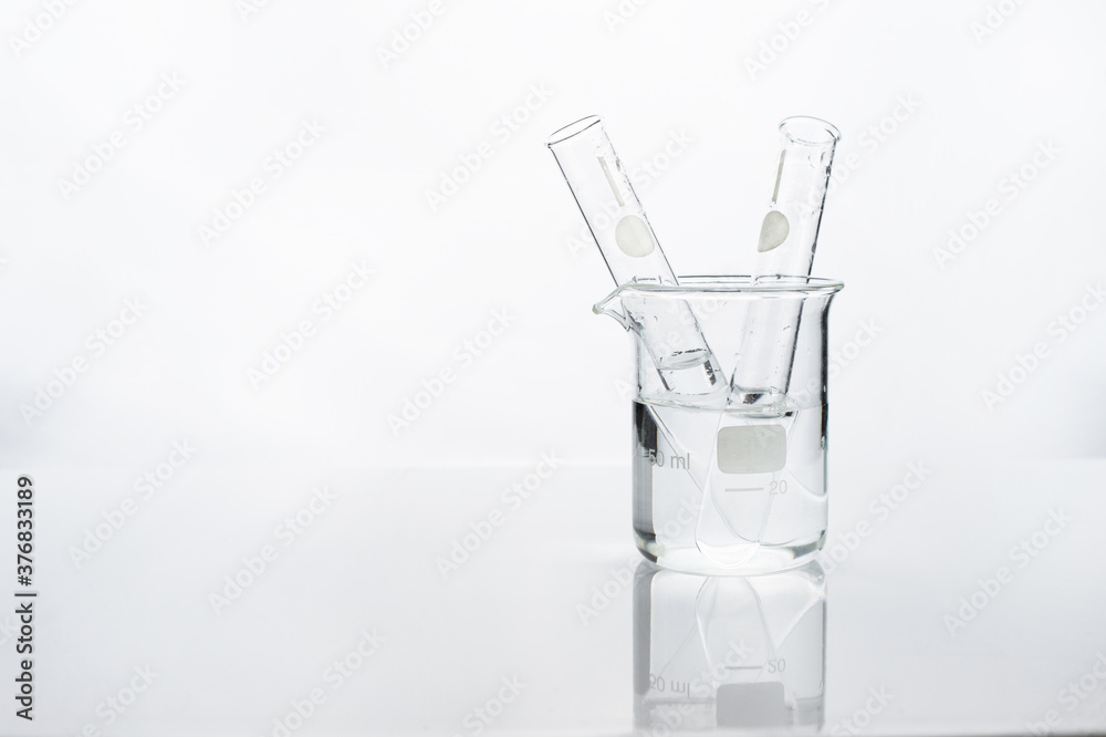 test tube in beaker with water in white chemistry science laboratory background test tube in beaker with water in white chemistry science laboratory background