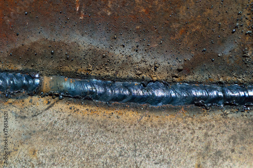 close-up - welding seam on iron surface