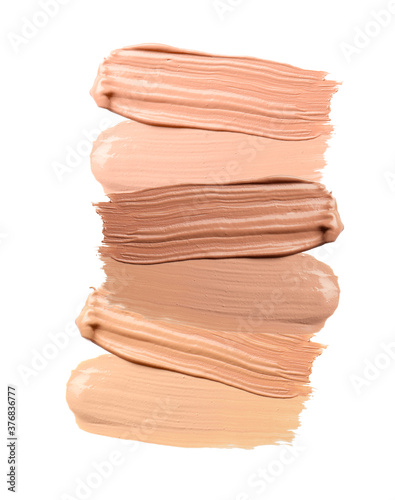 Fotografi Samples of foundation for makeup on white background