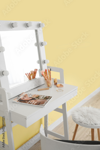 Table with mirror and makeu...