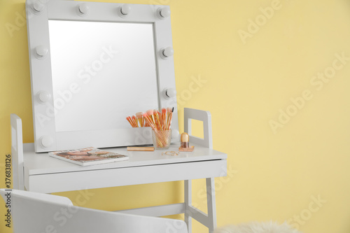Table with mirror and makeu...