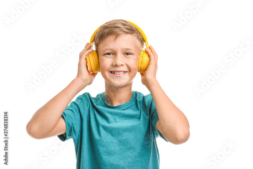 Little boy listening to mus...