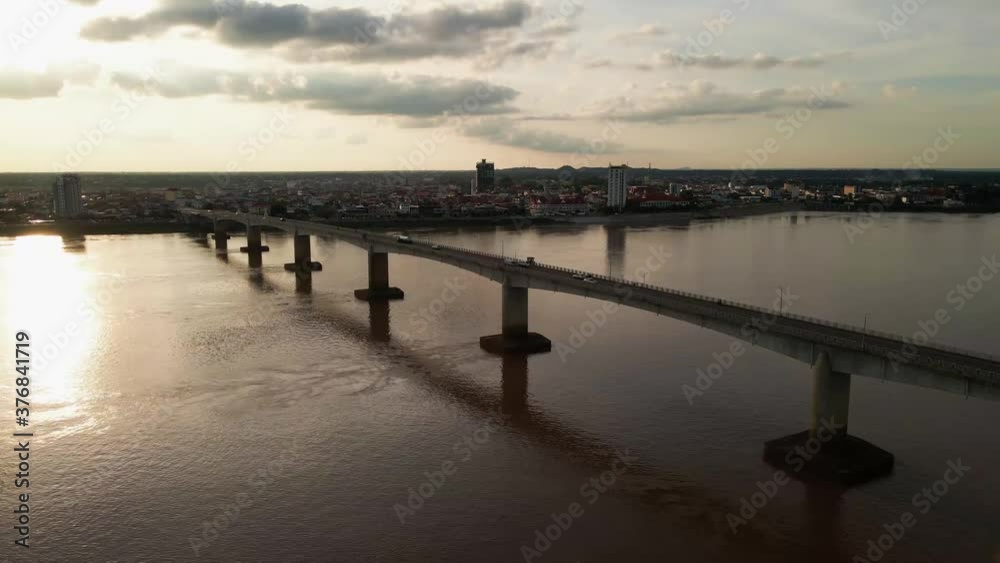 Kizuna bridge with traffic over the mighty Mekong, drone lift shot. Cambodia. Kizuna bridge with traffic over the mighty Mekong, drone lift shot. Cambodia.