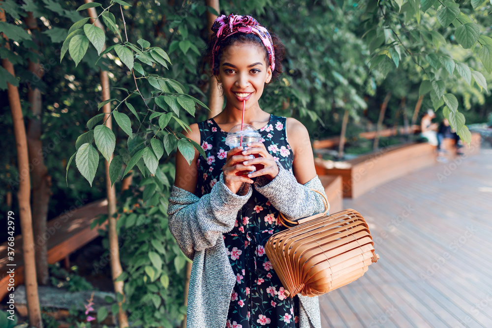 Smiling black woman in stylish hipster clothes grey cardigan