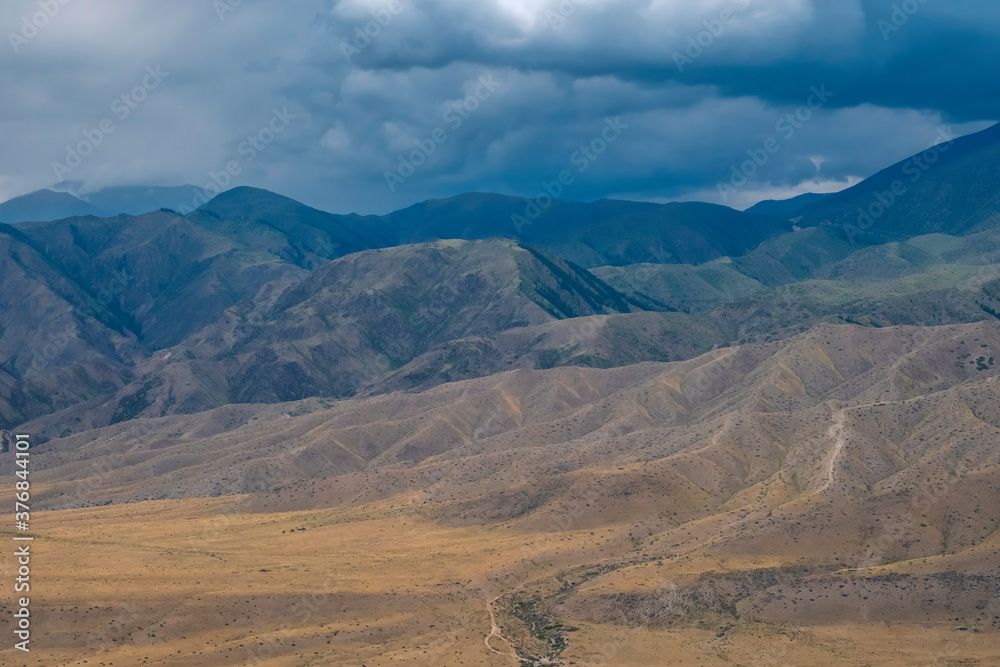 Beautiful mountains with stormy clouds, Summer nature view. Natural summer landscape. Cloud background. Beautiful mountains with stormy clouds, Summer nature view. Natural summer landscape. Cloud background.