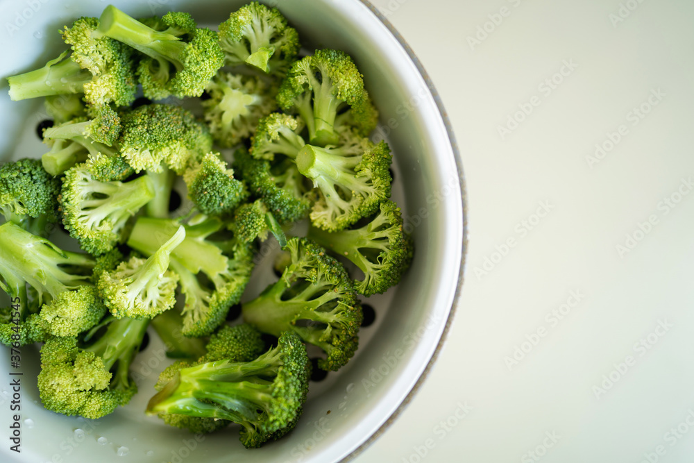 Fresh broccoli vegetables are in the steamer, ready to cook. Fresh broccoli vegetables are in the steamer, ready to cook.