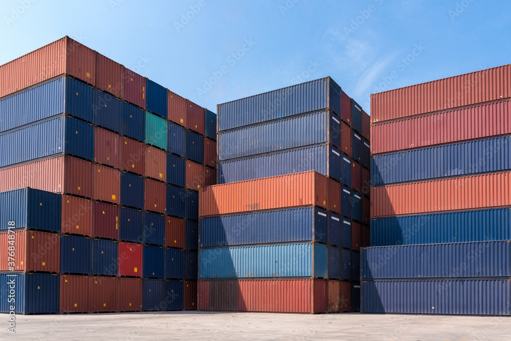 Colourful stack pattern of cargo shipping containers in shipping yard,dock yard for transportation,import,export industrial concept Colourful stack pattern of cargo shipping containers in shipping yard,dock yard for transportation,import,export industrial concept