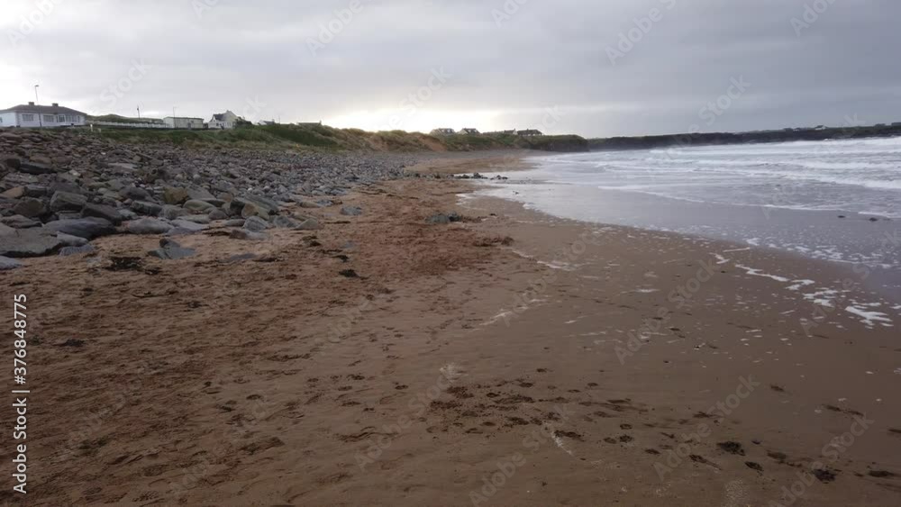 Walking on the beach in County Clare Ireland on an overcast day. Walking on the beach in County Clare Ireland on an overcast day.