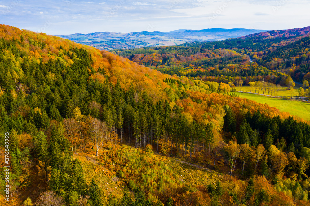 Aerial autumn rural landscape with hills, fields and forest