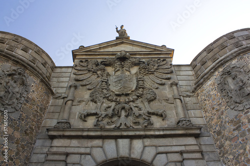 Coat of arms of Gate Puerta de Bisagra in Toledo, Spain © Lindasky76
