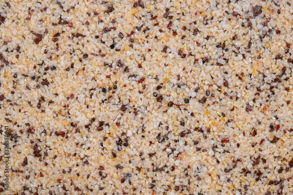 textural plaster of the house wall, colored granite chips, background textural plaster of the house wall, colored granite chips, background