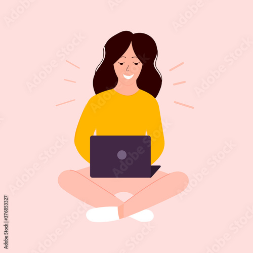 Woman with laptop sitting in yoga pose.Work at home. Woman sending email.