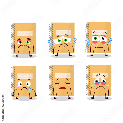 Brown spiral notebooks cartoon character with sad expression