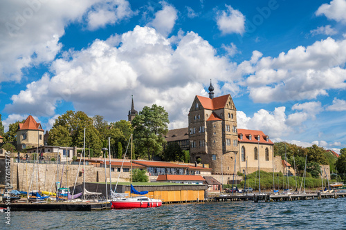 Schloss über dem Süßen See in Seeburg vor blauem Himmel mit Wolken photo